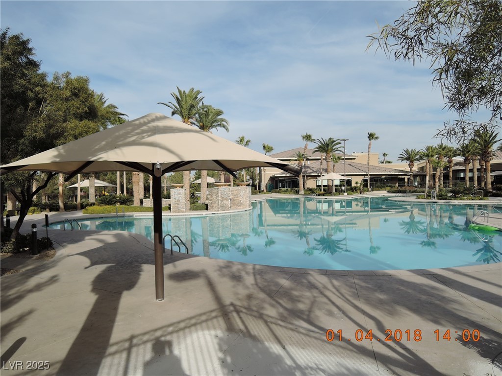 240 Rustic Club Way Las Vegas, NV 89148 - Photo 4 of 40 Community pool featuring a patio