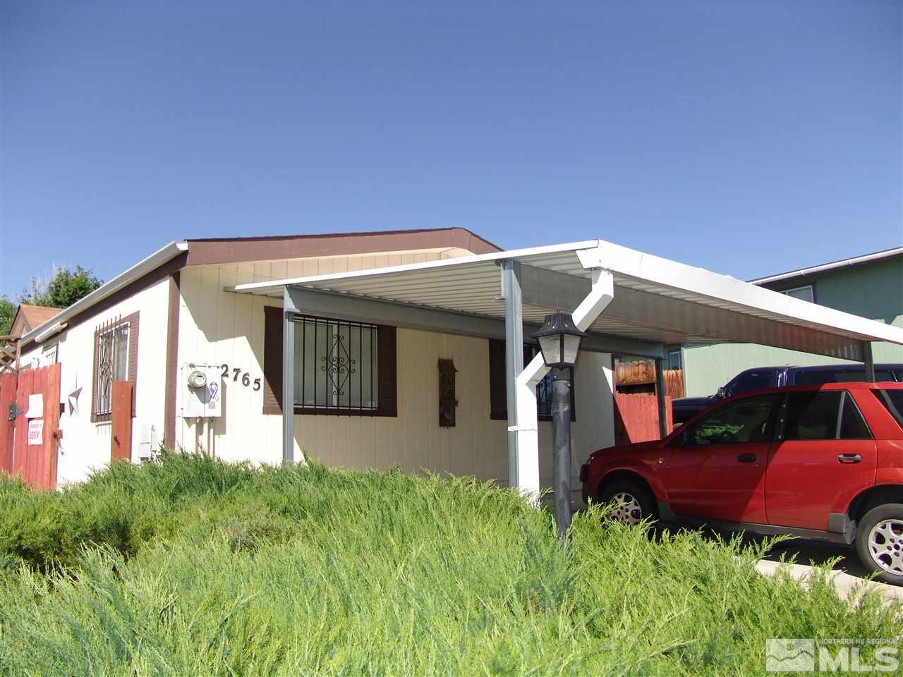 2765 Snapdragon Way Reno, NV 89512 - Photo 1 of 1 a front view of a house with garden