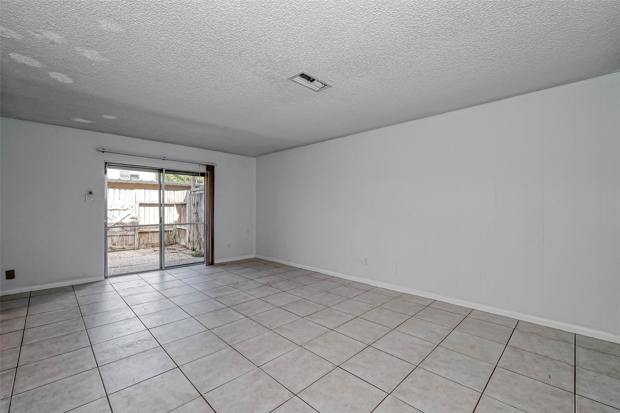 14179 Misty Meadow Lane Houston, TX 77079 - Photo 11 of 41 a view of an empty room and window