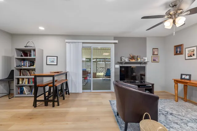 a work room with furniture and a bookshelf