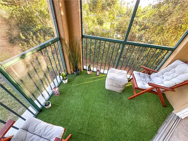 a view of a chair and table in the deck