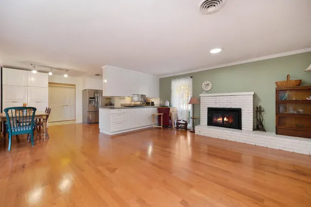 a view of kitchen with furniture and wooden floor
