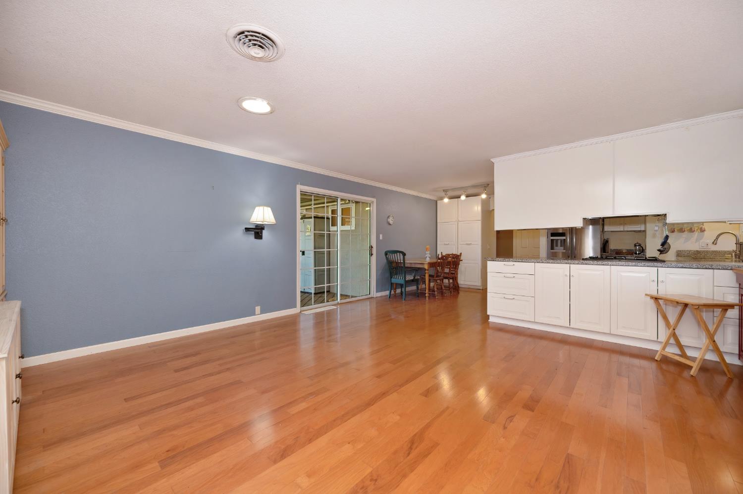 6430 Sandstone Street Carmichael, CA 95608 - Photo 18 of 39 a view of kitchen with furniture and wooden floor