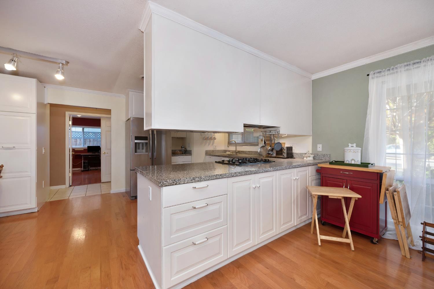6430 Sandstone Street Carmichael, CA 95608 - Photo 19 of 39 a kitchen with stainless steel appliances granite countertop a stove a sink and a refrigerator