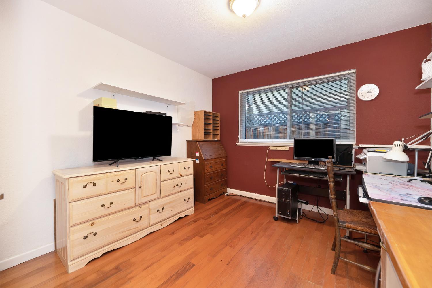 6430 Sandstone Street Carmichael, CA 95608 - Photo 20 of 39 a view of a workspace with furniture and a flat screen tv