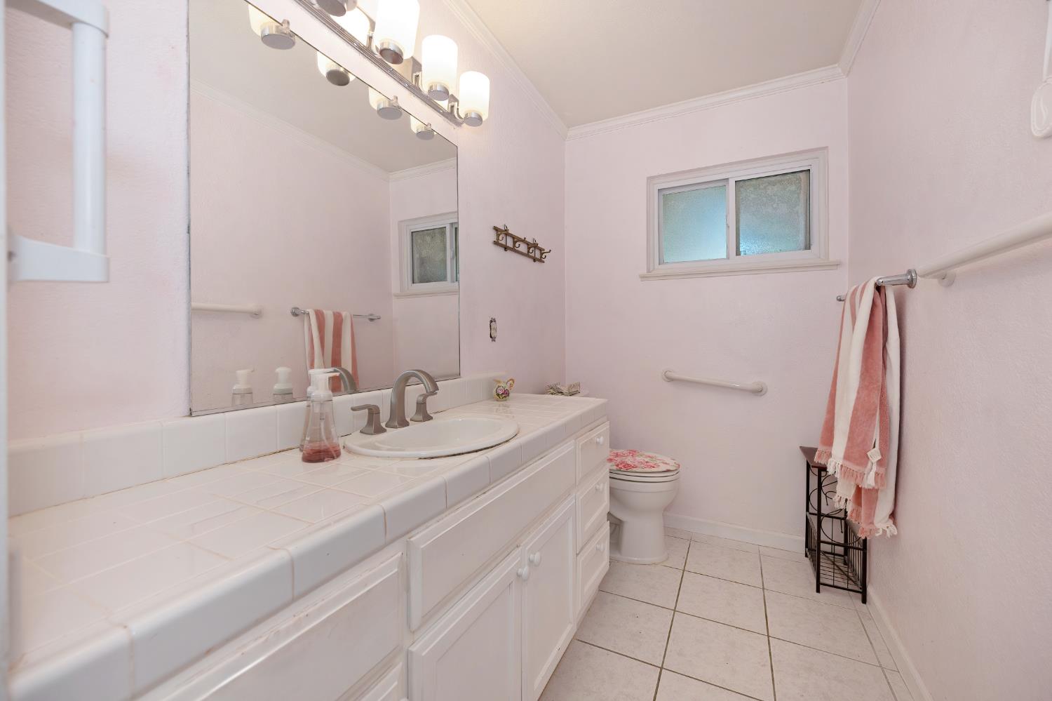 6430 Sandstone Street Carmichael, CA 95608 - Photo 22 of 39 a bathroom with a double vanity sink and a mirror