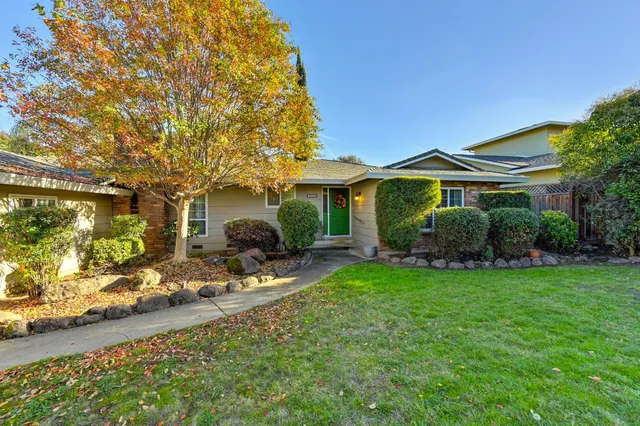 a front view of a house with garden