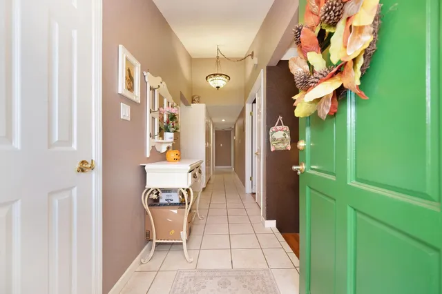 a living room with furniture fireplace and a table