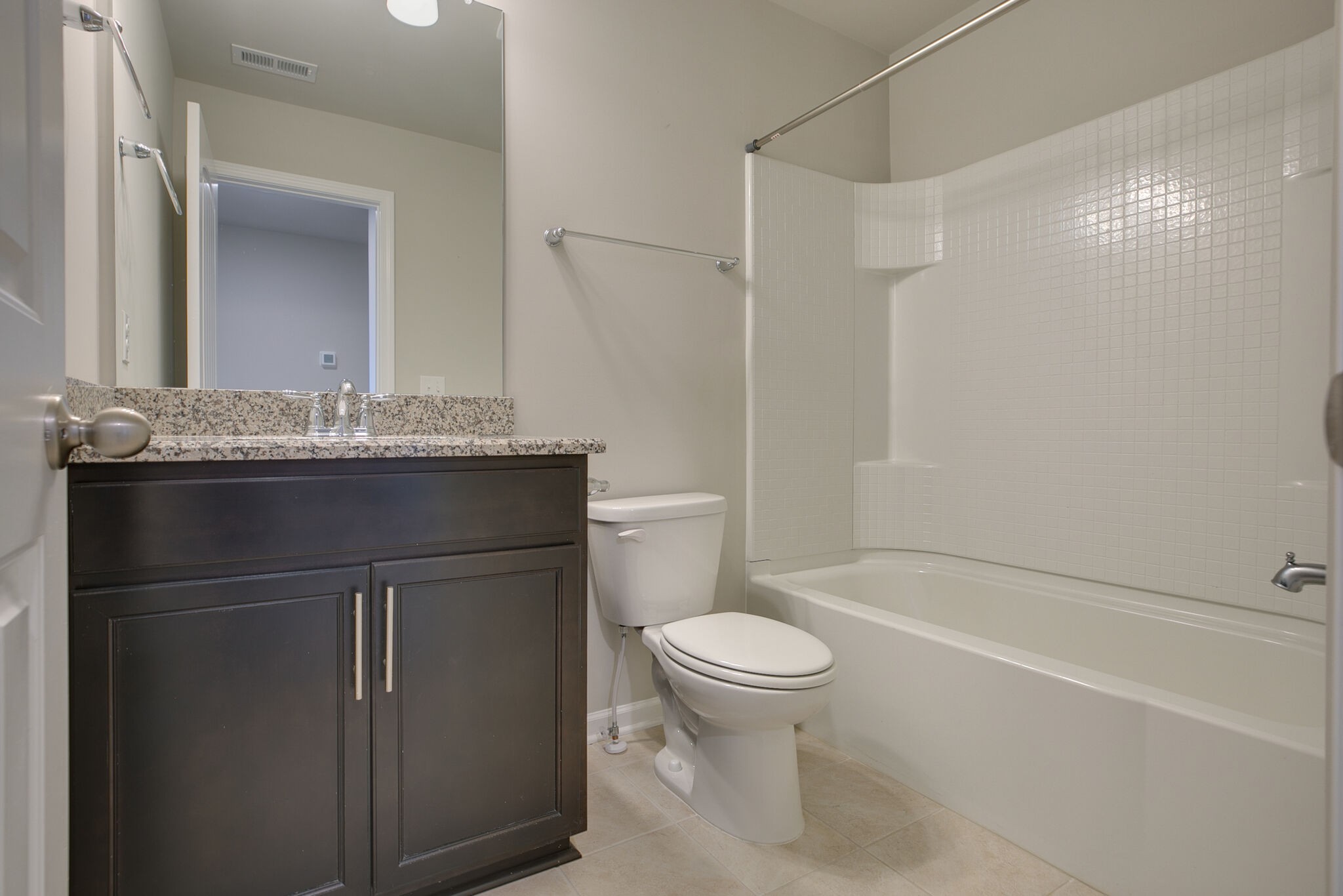 4283 Grapevine Loop Smyrna, TN 37167 - Photo 24 of 30 a bathroom with a granite countertop sink toilet and shower