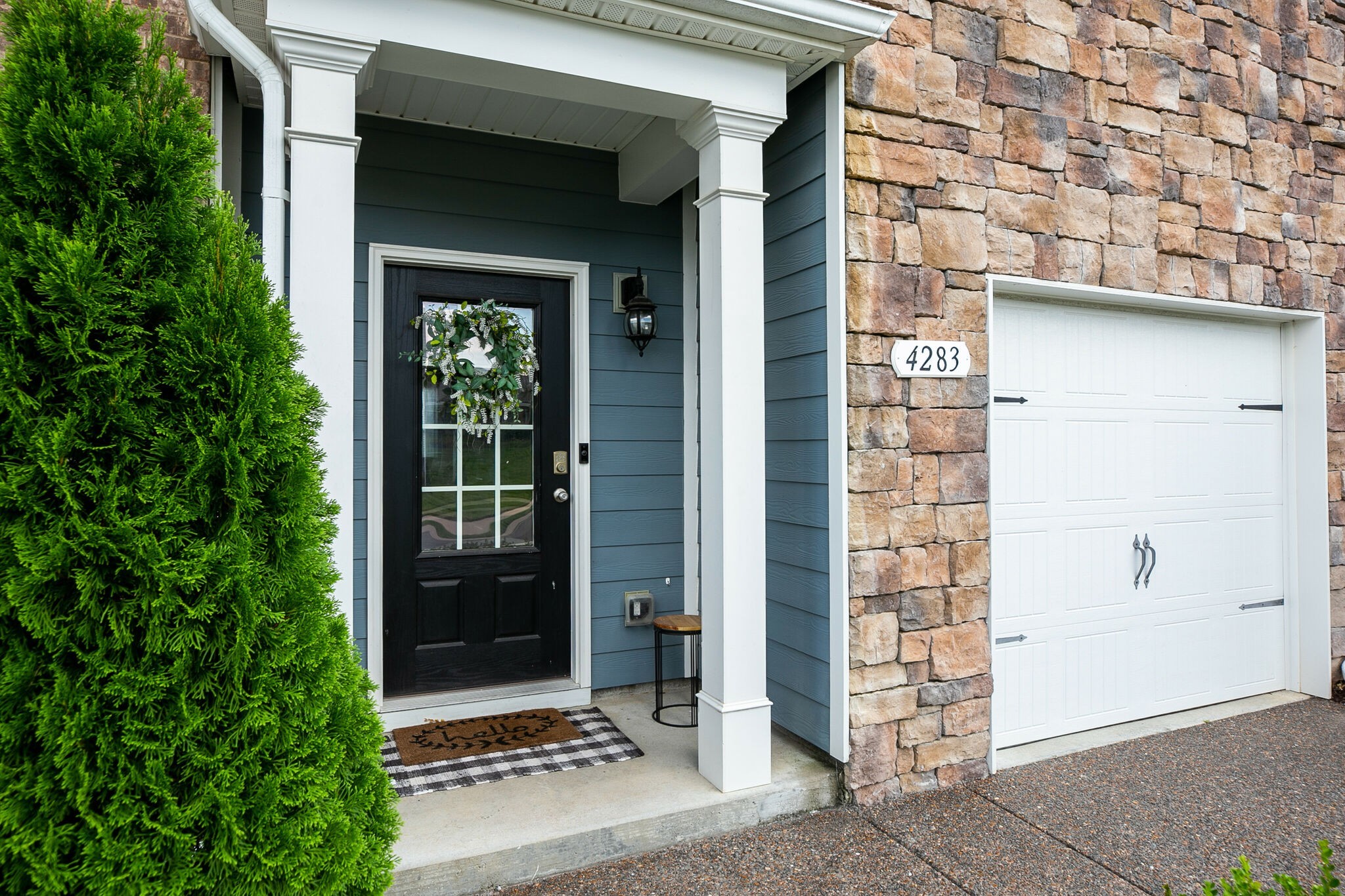 4283 Grapevine Loop Smyrna, TN 37167 - Photo 3 of 30 a front view of a house with a glass door and shower