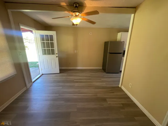 a view of entryway with wooden floor