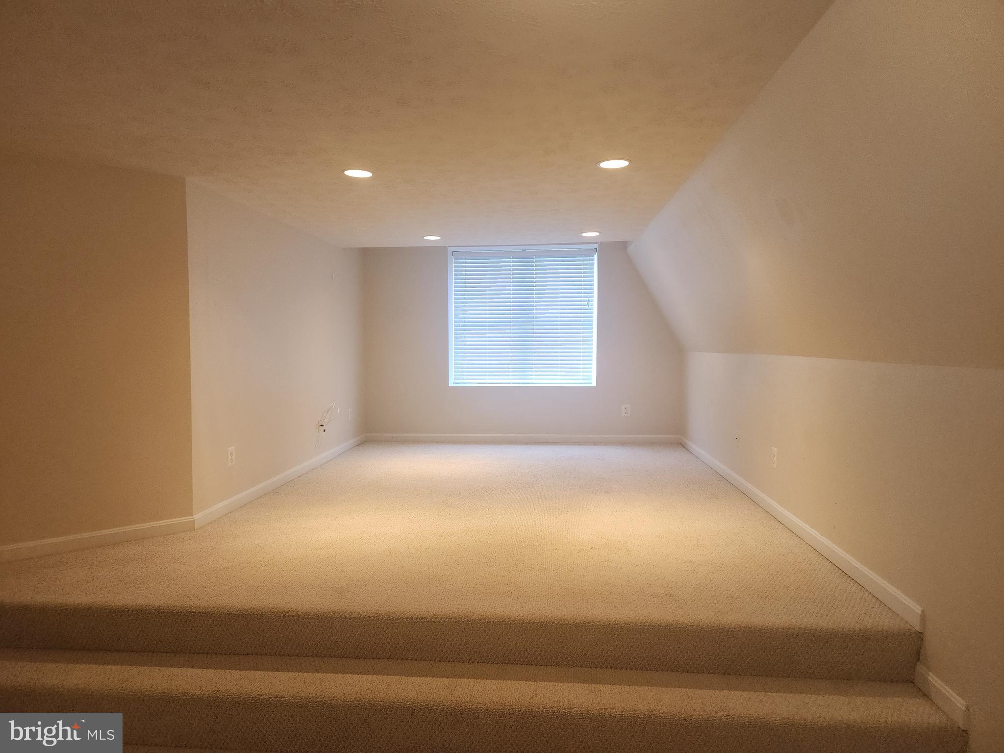 36548 Notley Hall Road, Unit A Chaptico, MD 20621 - Photo 6 of 8 a view of an empty room with a window