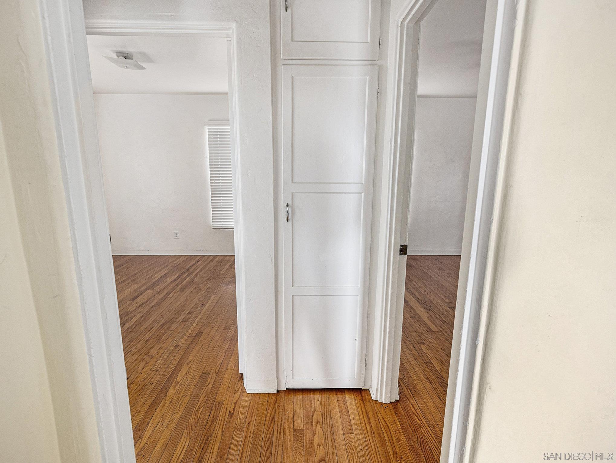 814 San Luis Rey Place San Diego, CA 92109 - Photo 11 of 29 a view of a hallway with wooden floor