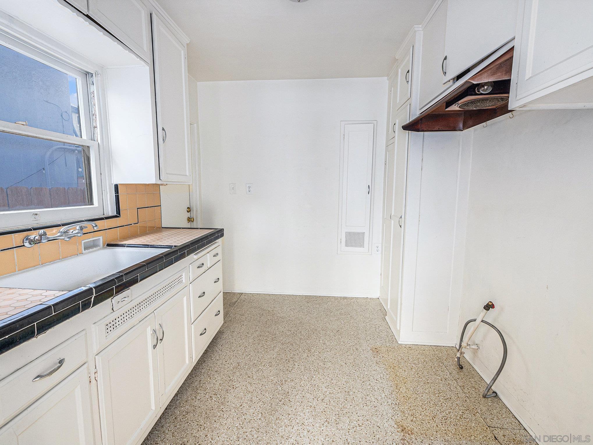 814 San Luis Rey Place San Diego, CA 92109 - Photo 7 of 29 a spacious bathroom with a granite countertop sink and a mirror