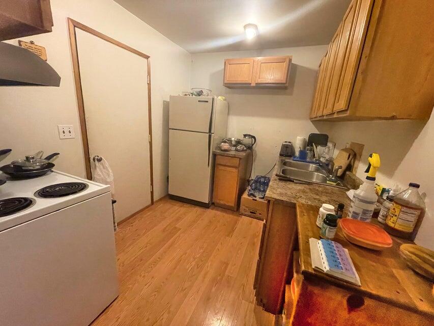 2565 Rockydale Road Cave Junction, OR 97523 - Photo 4 of 14 a room with furniture and a wooden floor