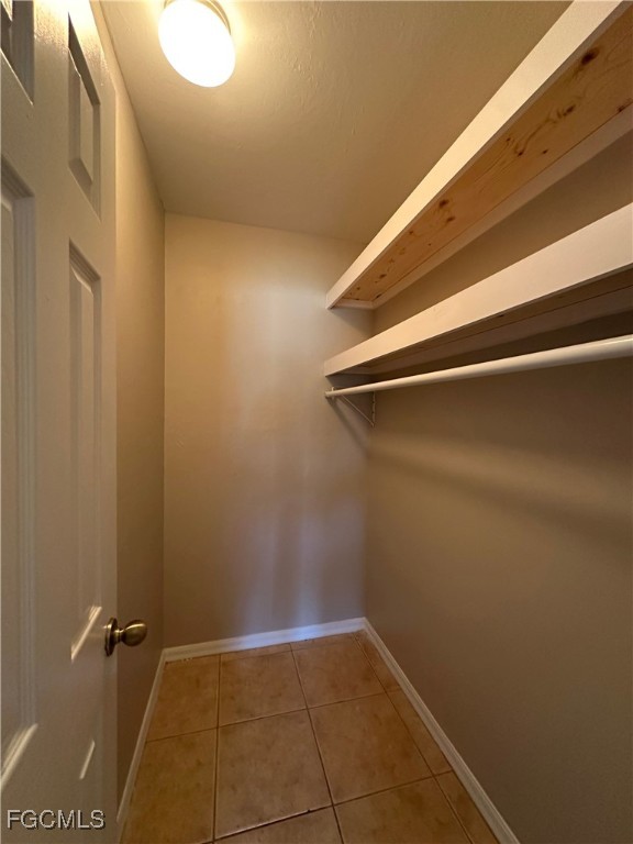 2411 Park Road, Unit 2409 Lehigh Acres, FL 33971 - Photo 12 of 20 a view of a room with rack on the wall