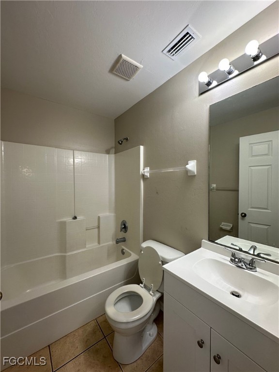 2411 Park Road, Unit 2409 Lehigh Acres, FL 33971 - Photo 16 of 20 a bathroom with a sink a toilet and shower