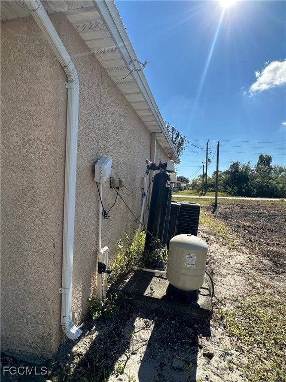 2411 Park Road, Unit 2409 Lehigh Acres, FL 33971 - Photo 18 of 20 a view of a balcony with chairs potted plants