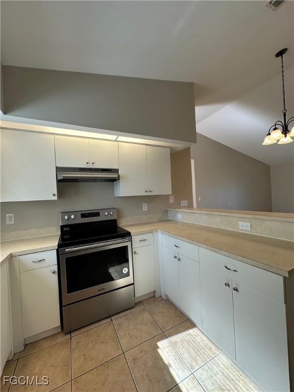 2411 Park Road, Unit 2409 Lehigh Acres, FL 33971 - Photo 9 of 20 a kitchen with a stove and a sink