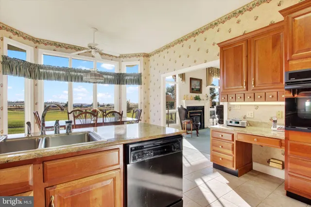 a kitchen with stainless steel appliances granite countertop a stove and a sink