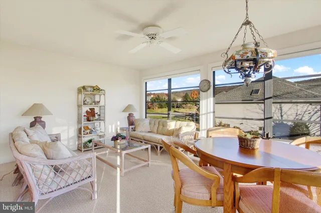a dining room with furniture and window