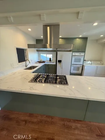 a kitchen with a stove and a refrigerator