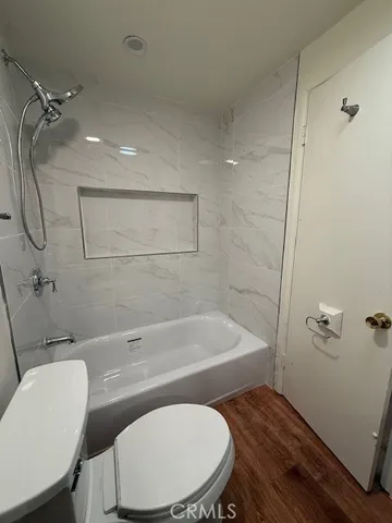 a bathroom with a double vanity sink and a toilet