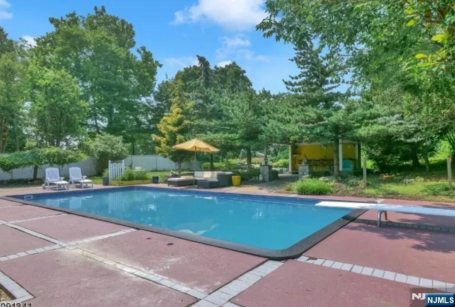 149 Oldham Road Wayne, NJ 07470 - Photo 15 of 19 a view of a patio with swimming pool table and chairs