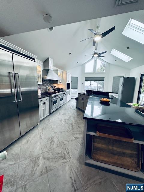 149 Oldham Road Wayne, NJ 07470 - Photo 3 of 19 a kitchen with stainless steel appliances granite countertop a stove a sink and a refrigerator