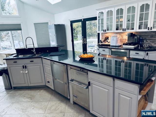 149 Oldham Road Wayne, NJ 07470 - Photo 4 of 19 a kitchen with stainless steel appliances a sink and cabinets