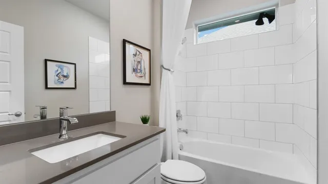 a bedroom with furniture and a wooden floor