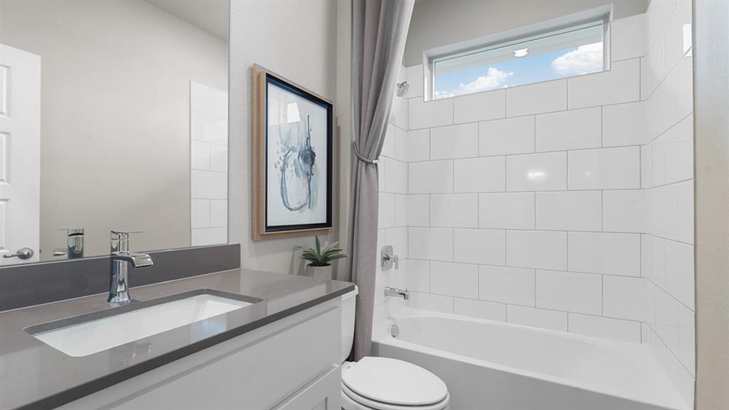 1924 Jackson Street Cleburne, TX 76033 - Photo 26 of 34 a bathroom with a granite countertop sink toilet and shower