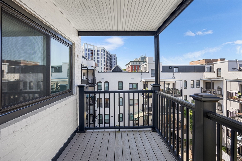 4 Commonwealth Court, Unit 20 Boston, MA 02135 - Photo 15 of 22 a view of a balcony with furniture