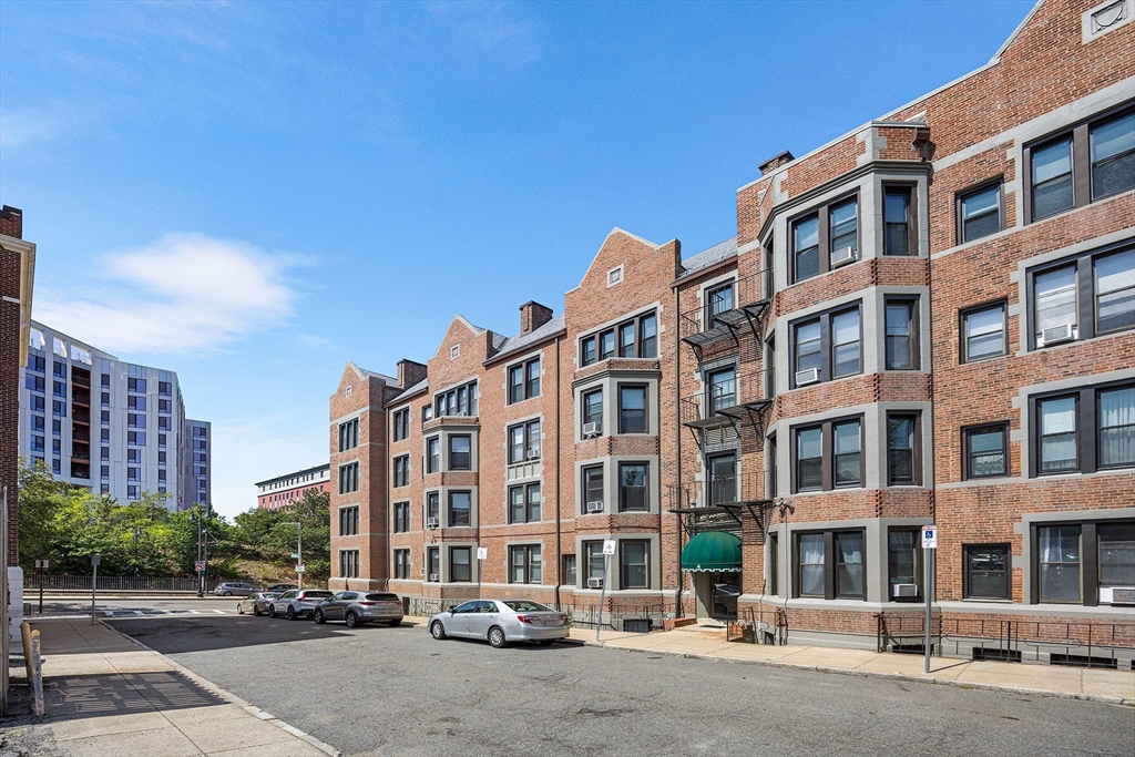 4 Commonwealth Court, Unit 20 Boston, MA 02135 - Photo 21 of 22 a front view of a building with street