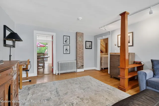 a view of a livingroom with furniture and a flat screen tv