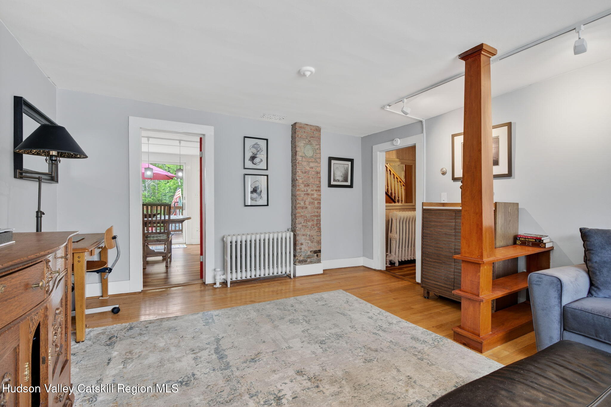 8213 Main Street Hunter, NY 12442 - Photo 11 of 44 a view of a livingroom with furniture and a flat screen tv