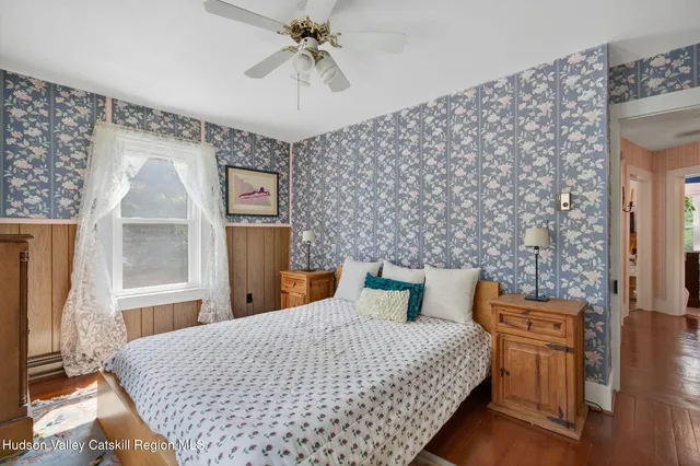 a bedroom with bed and window