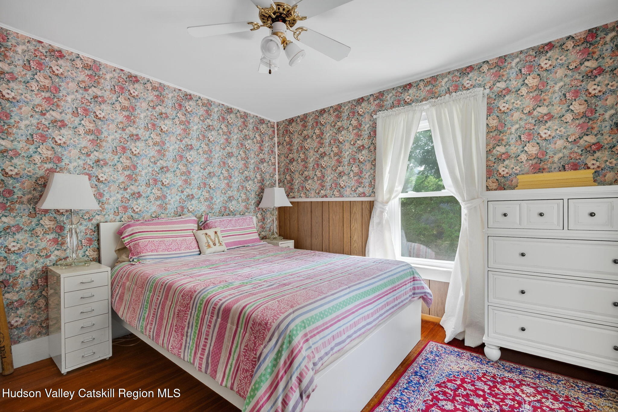 8213 Main Street Hunter, NY 12442 - Photo 21 of 44 a bedroom with a bed and a window