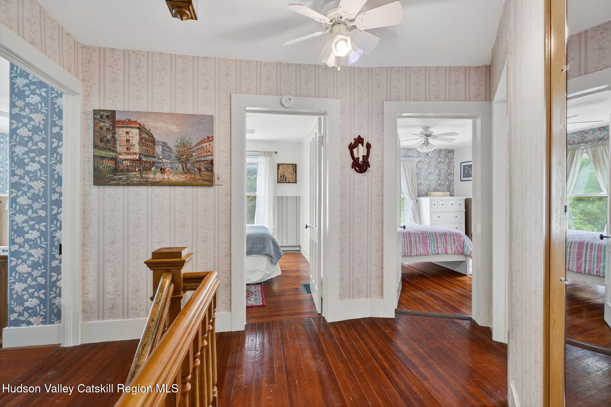 8213 Main Street Hunter, NY 12442 - Photo 22 of 44 a view of a hallway with wooden floor and a livingroom