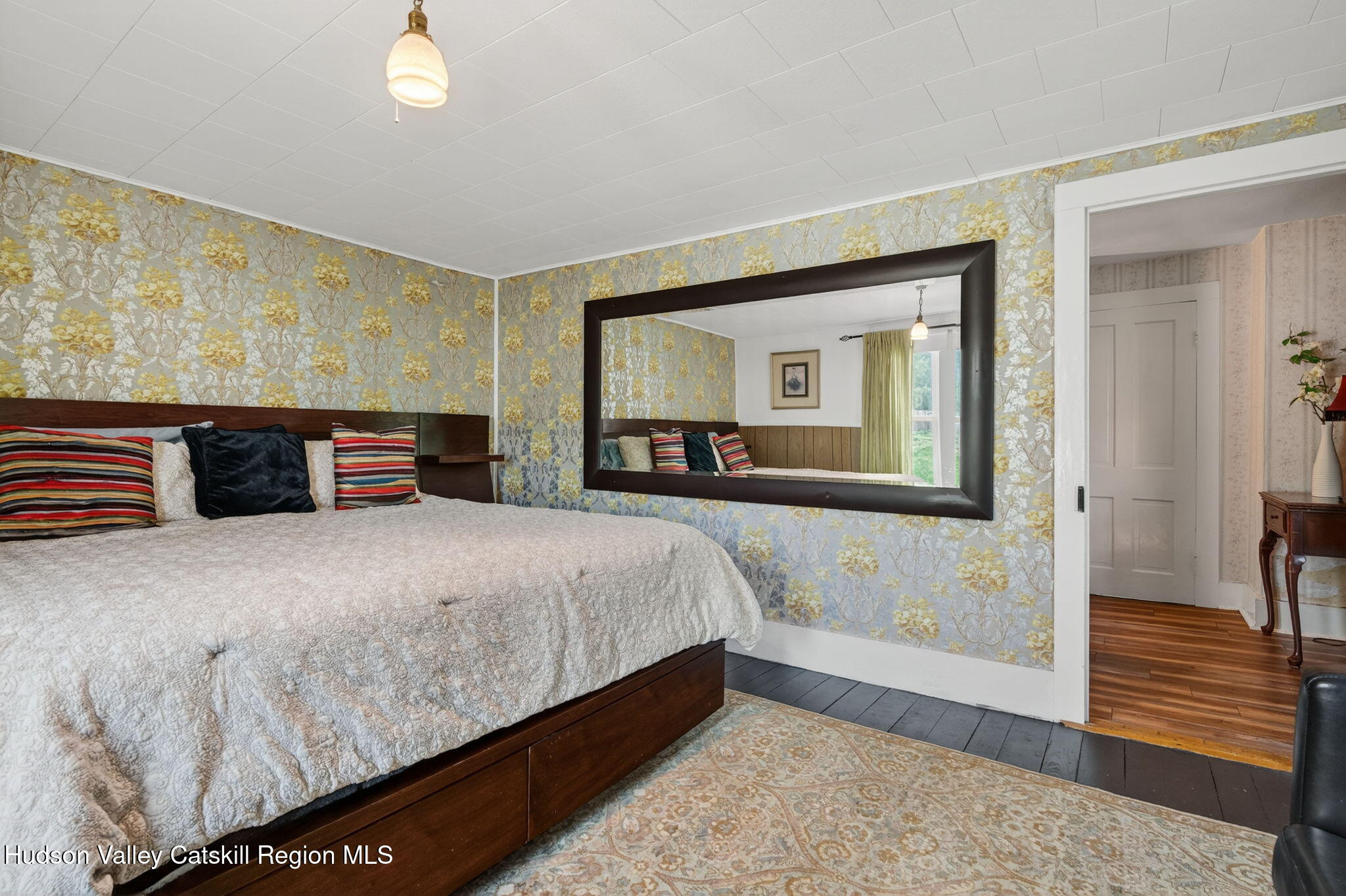 8213 Main Street Hunter, NY 12442 - Photo 24 of 44 a bedroom with a bed and dresser