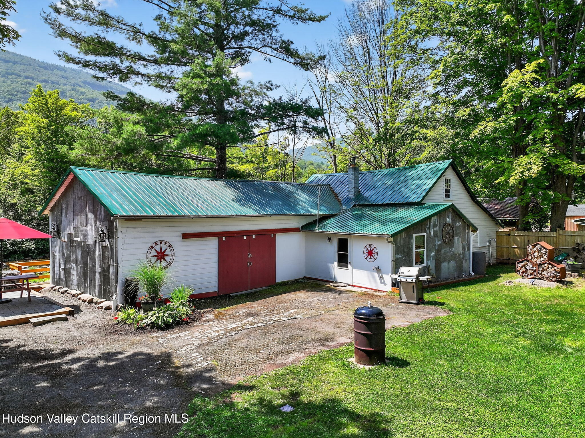 8213 Main Street Hunter, NY 12442 - Photo 25 of 44 a front view of a house with a yard