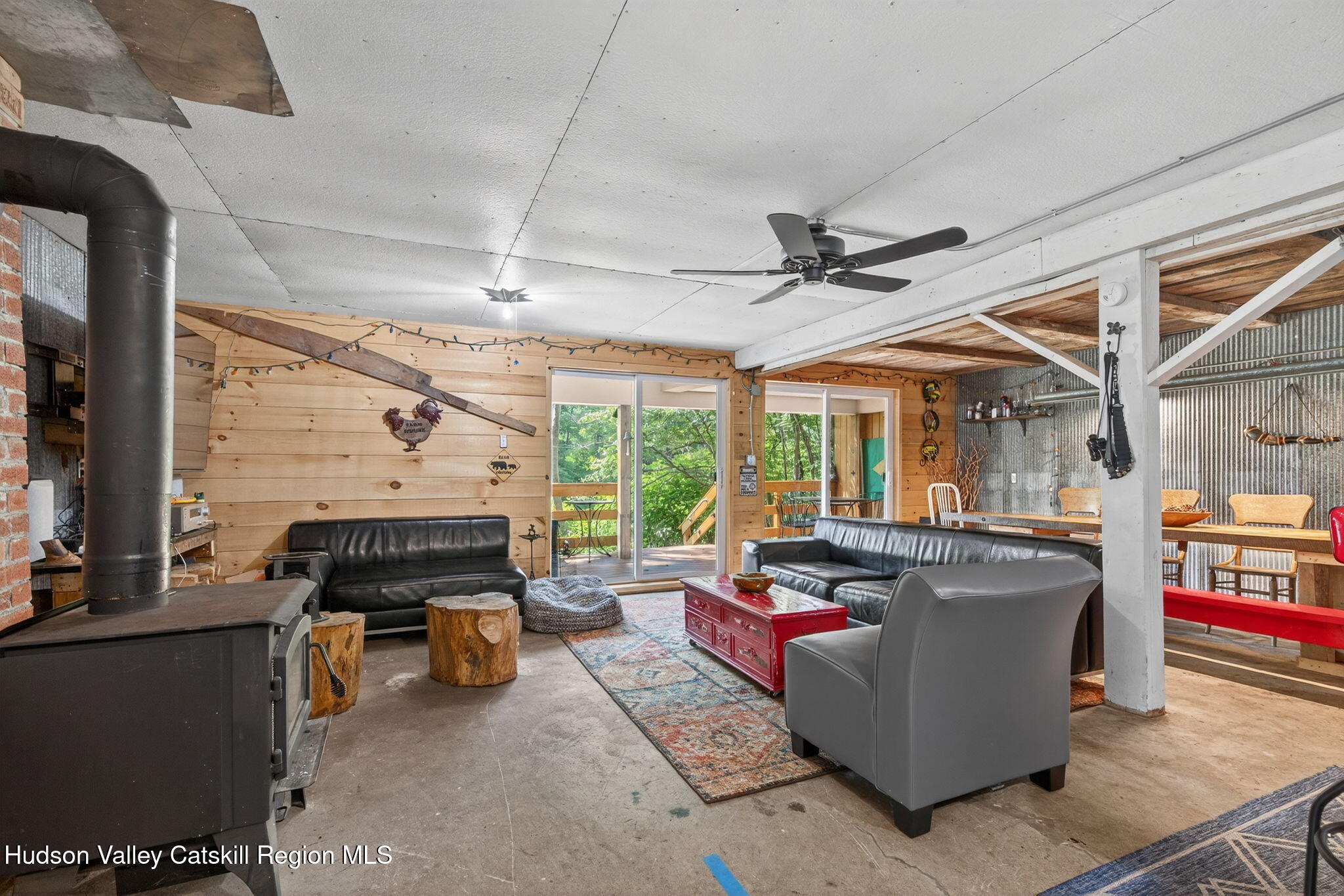 8213 Main Street Hunter, NY 12442 - Photo 27 of 44 a living room with fireplace furniture and a large window