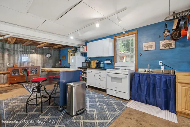 a kitchen with a sink cabinets and window
