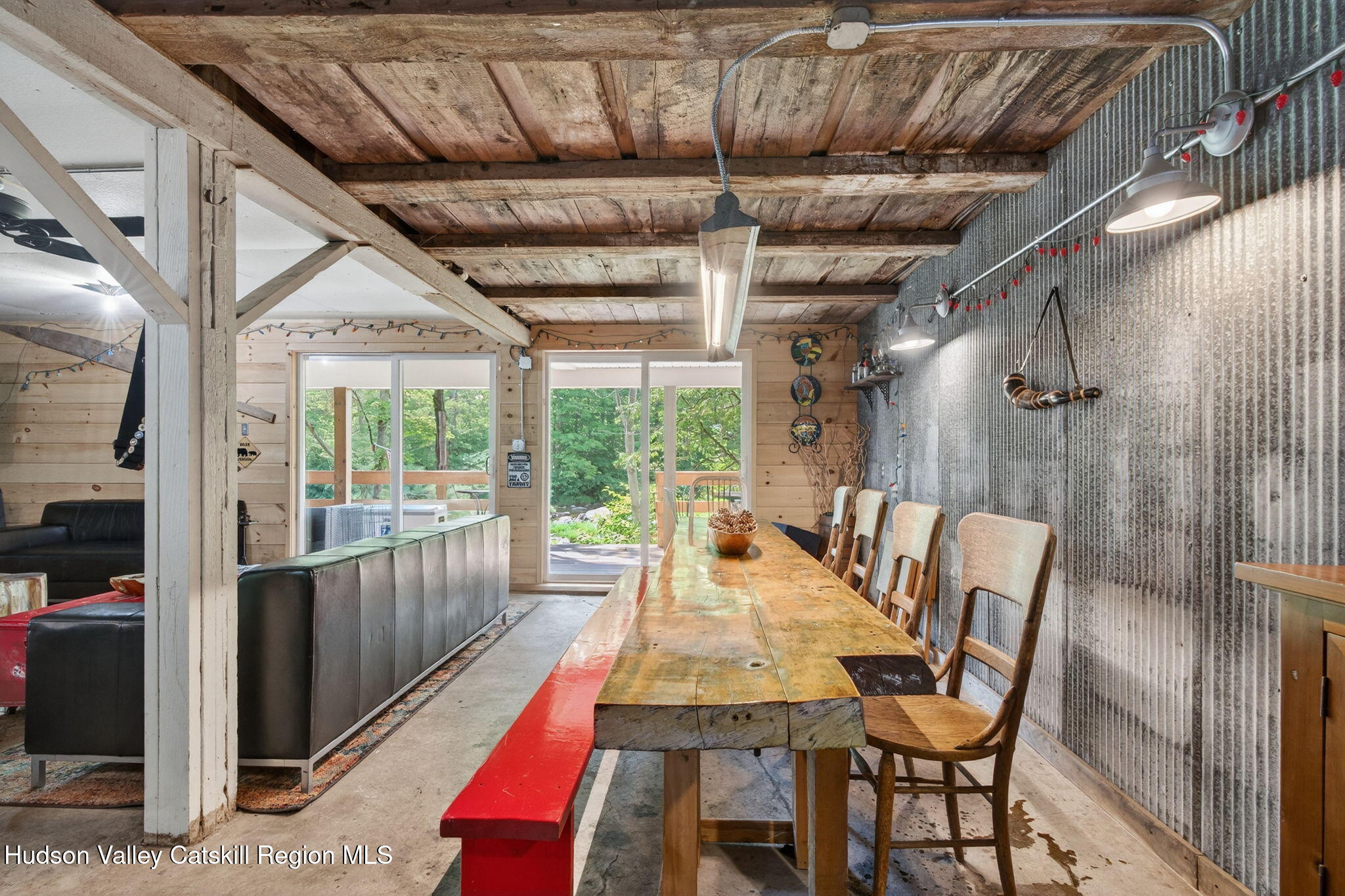 8213 Main Street Hunter, NY 12442 - Photo 29 of 44 a view of a patio with table and chairs and wooden floor