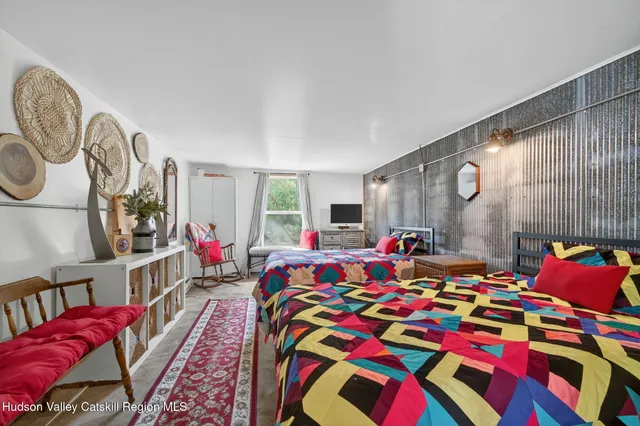 a bed room with a bed and a book shelf