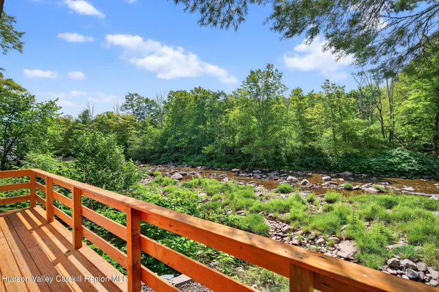 a view of a balcony with wooden fence