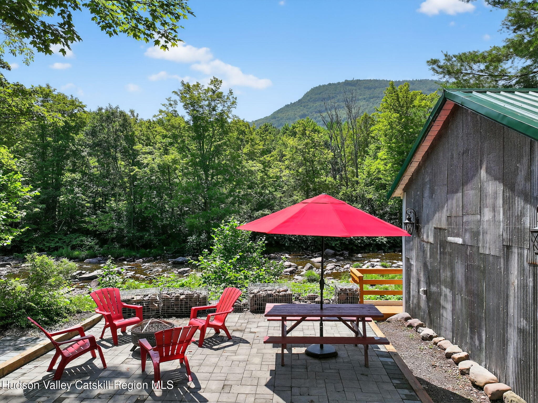 8213 Main Street Hunter, NY 12442 - Photo 35 of 44 an outdoor sitting area with furniture and wooden deck