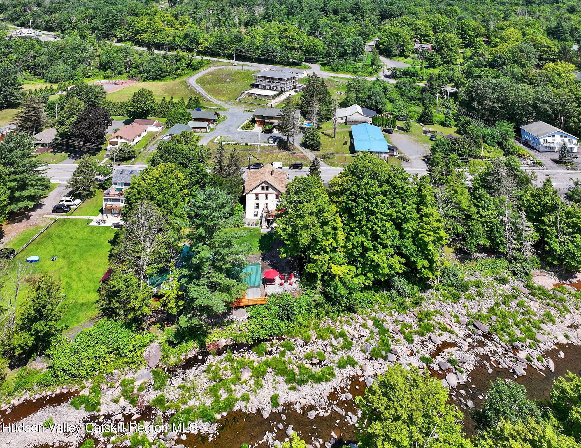 8213 Main Street Hunter, NY 12442 - Photo 42 of 44 an aerial view of residential house with outdoor space and trees all around