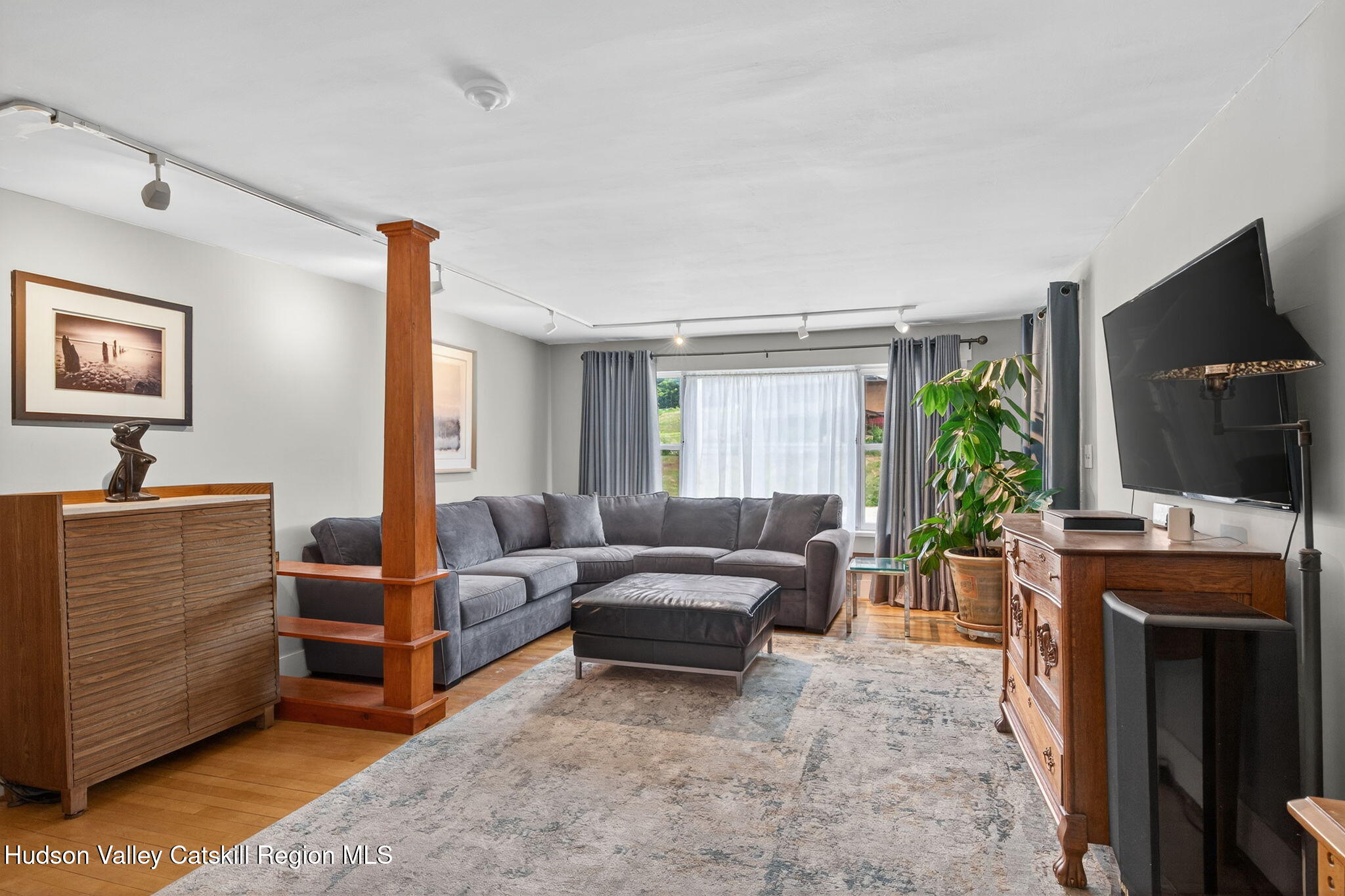 8213 Main Street Hunter, NY 12442 - Photo 10 of 44 a living room with furniture and a flat screen tv