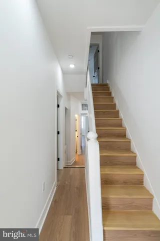 a view of a hallway with staircase